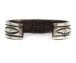 Orville Tsinnie (1943-2017) - Navajo - Heavy Sterling Silver Bracelet with Stamped Design c. 1970-80s, size 7