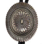 Thomas Curtis (1942-2013) - Navajo - Sterling Silver and Leather Bolo Tie c. 1970s, 2.875" x 2.25" bolo