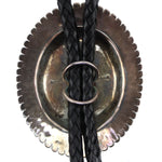 Thomas Curtis (1942-2013) - Navajo - Sterling Silver and Leather Bolo Tie c. 1970s, 2.875" x 2.25" bolo
