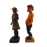 Pair of Wood Carved Figurines - (1.) Dee Flagg (1922-1999) - "Annie Oakley" with (Unsigned) Standing Man