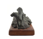 Mark Rossi - Mountain Lion Walking Down Rock Formation