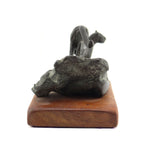 Mark Rossi - Mountain Lion Walking Down Rock Formation