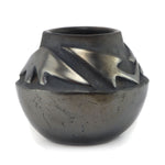 Rose Gonzales (1900-1989) - San Ildefonso Black Gunmetal Jar with Carved Avanyu Design c. 1940s, 4" x 4.75"