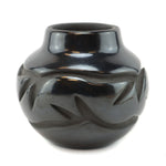 Anita Louise Suazo (b. 1937) - Santa Clara Black Jar with Carved Avanyu Design c. 1980s, 4" x 4.5"