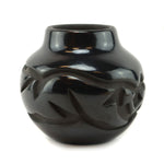 Anita Louise Suazo (b. 1937) - Santa Clara Black Jar with Carved Avanyu Design c. 1980s, 4" x 4.5"