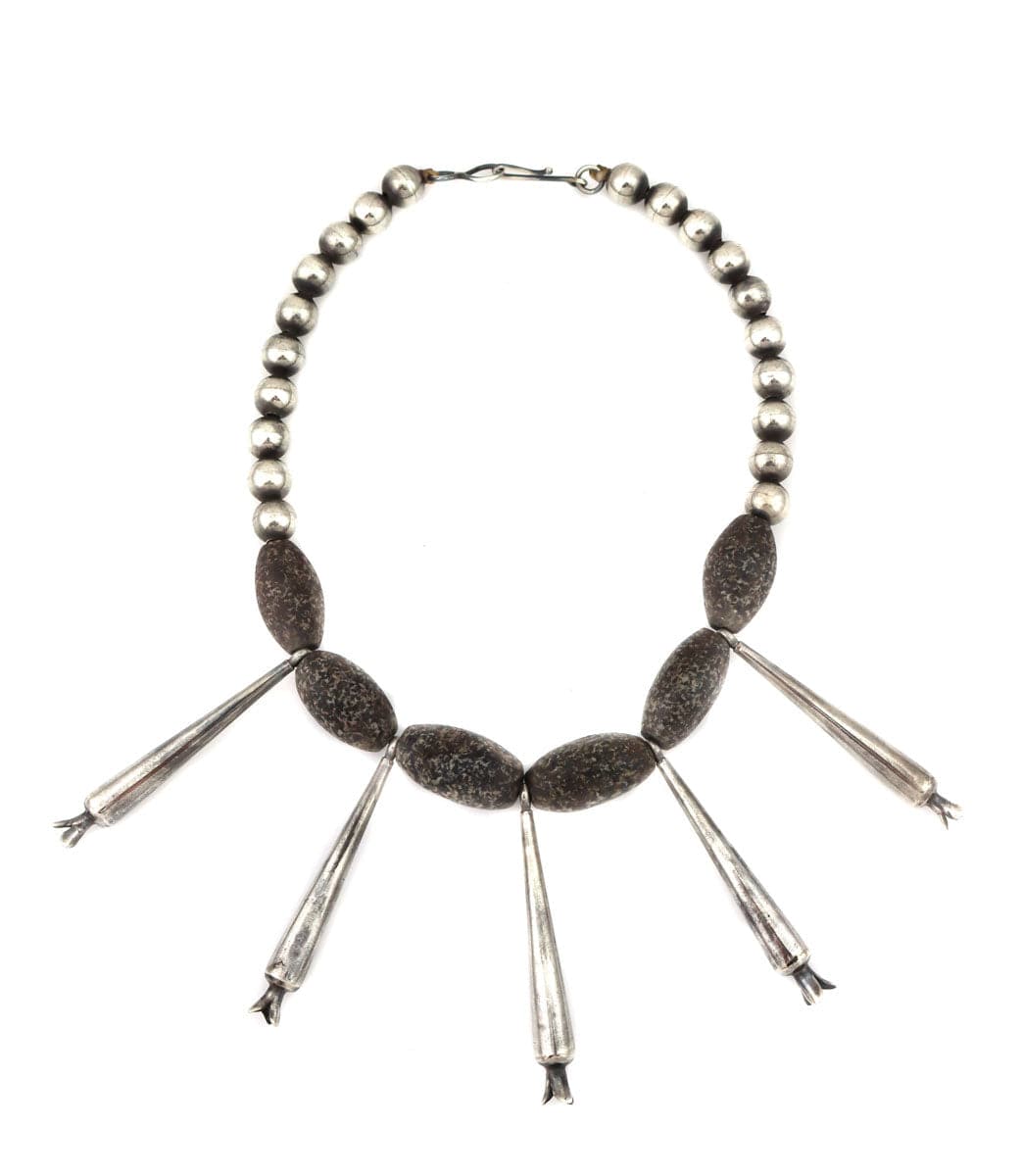 Binary file
Miramontes - Old Style Necklace on Silver Beads with 6 Ancient Oval Granite Beads and 5 Long Silver Blossoms, 16.5" Length (J91305-1221-013)